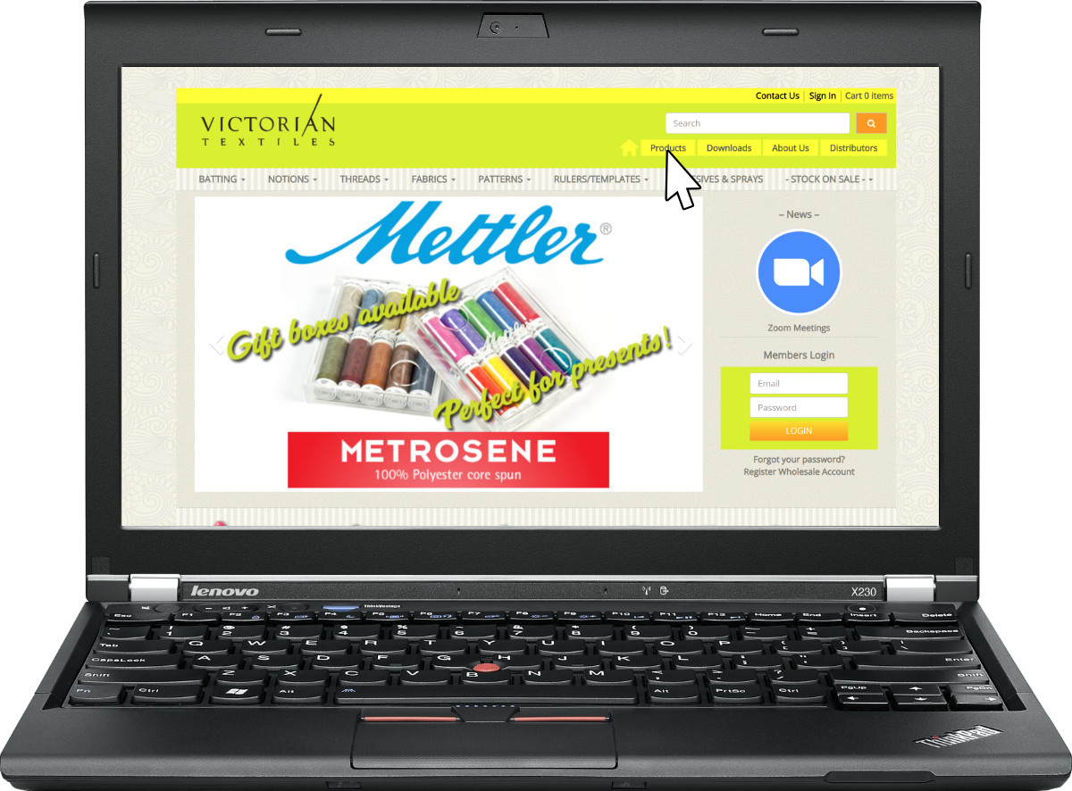 A laptop showing the Victorian Textiles Homepage