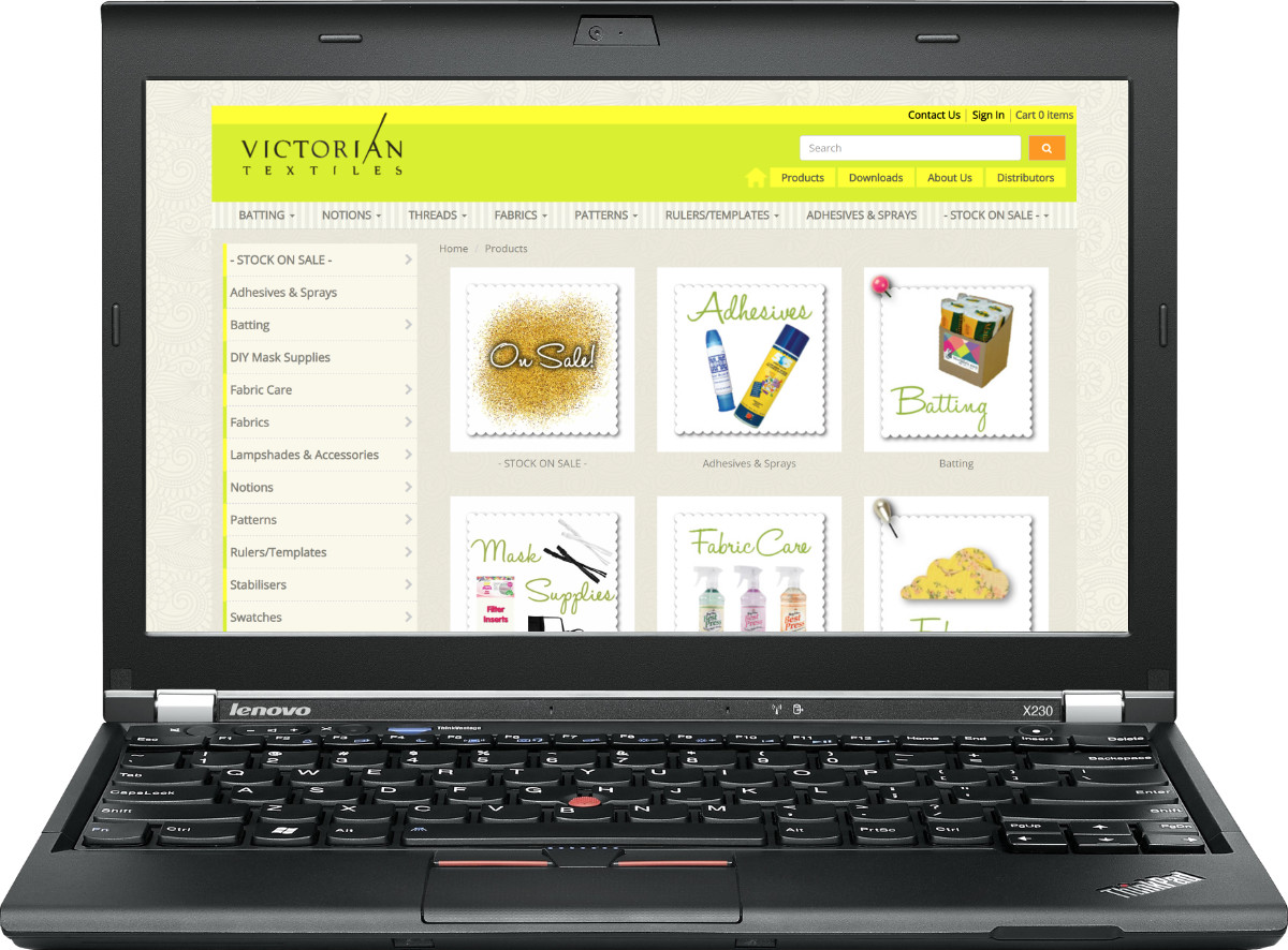 A Laptop  showing the category listing on the Victorian Textiles website.